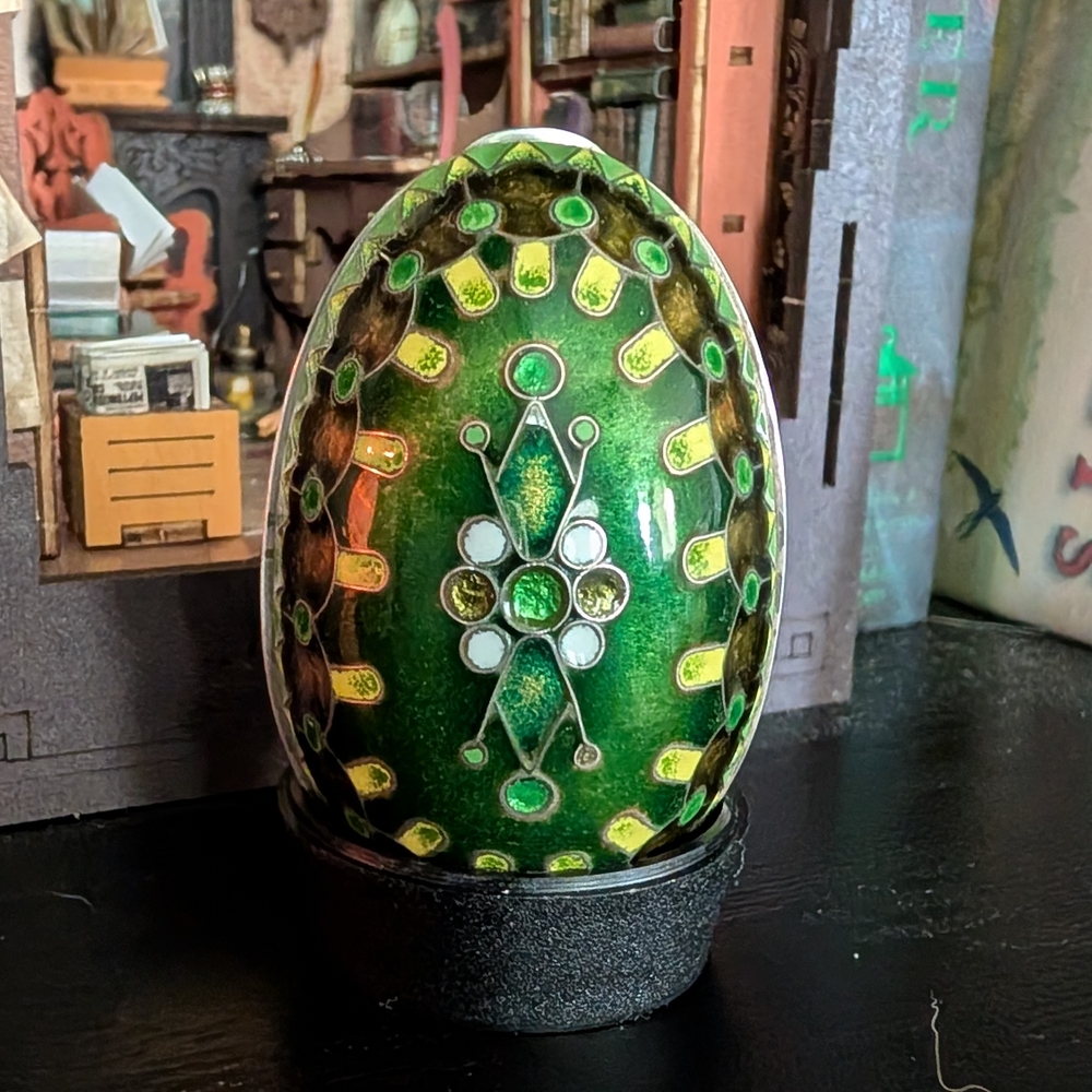 Artistic Green Ceramic Egg with Decorative Design